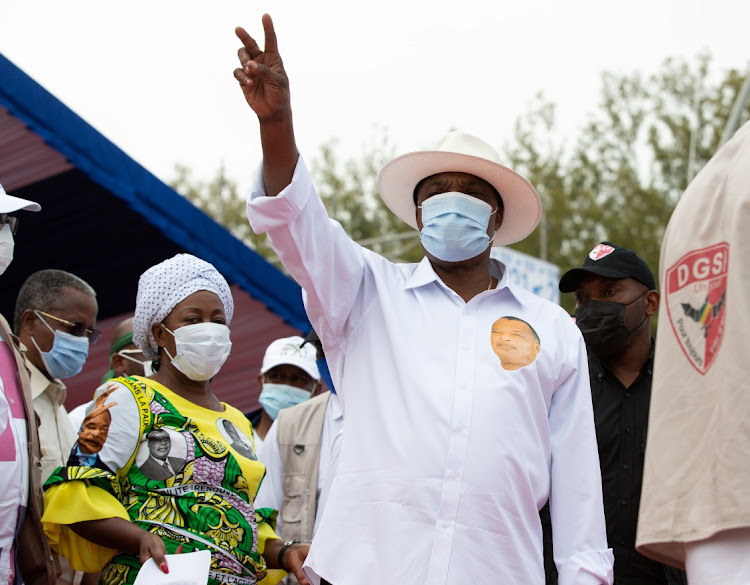 President and candidate for the presidential elections Denis Sassou Nguesso waves to a crowd at an election rally in Brazzaville, Republic of Congo, on March 19, 2021.