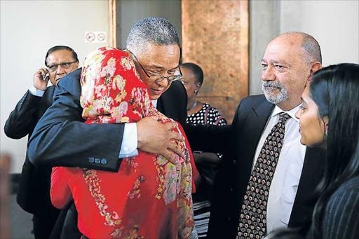 COURT VICTORY: Suspended Independent Police Investigative Directorate head Robert McBride is hugged by Roshan Arnold from the Helen Suzman Foundation. The Constitutional Court ruled yesterday that the police minister’s decision to suspend McBride was invalid Picture: ALON SKUY