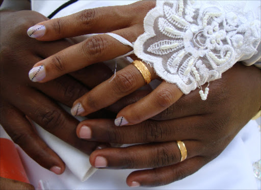 BOND: Newlyweds show off their wedding rings. Providing the right to marry but limiting it to only to the opposite sex is discrimination on the grounds of sex.Photo/Nobert Allan