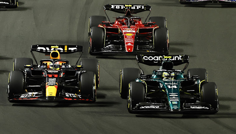 Aston Martin’s Fernando Alonso in action ahead of Red Bull’s Sergio Perez and Ferrari’s Carlos Sainz Jr at the start of the race. Picture: REUTERS