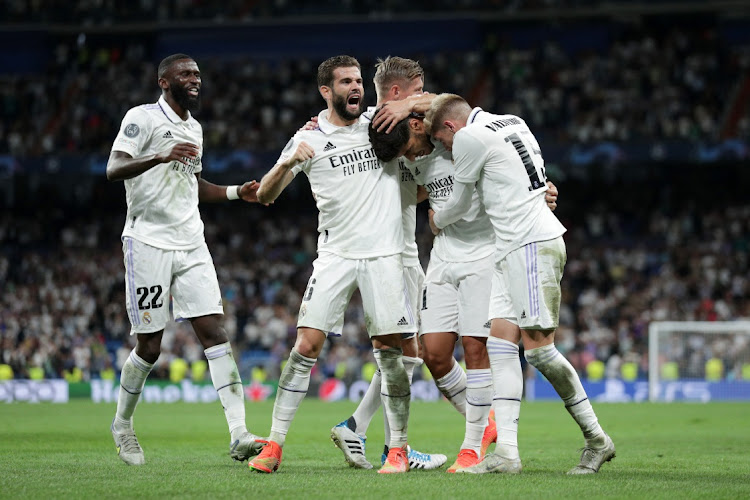 Marco Asensio of Real Madrid celebrates with Nacho Fernandez and teammates after scoring their side's second goal during the UEFA Champions League group F match between Real Madrid and RB Leipzig at Estadio Santiago Bernabeu on September 14 2022 in Madrid, Spain. Picture: GETTY IMAGES/GONZALO ARROYO MORENO