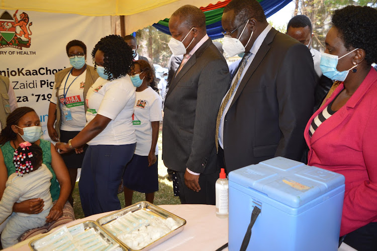 Cabinet secretary Health CS Mutahi Kagwe, Governor James Nyoro and deputy governor Joyce Ngugi during the mass roll out campaign in Kiamu county on September 29, 2021