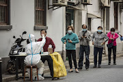 Residents queue at a Covid-19 testing station in Shanghai, China, on Sunday, November 6, 2022. China will “unswervingly” adhere to its current Covid controls as the country faces increasingly serious outbreaks, health officials said, damping hopes that Beijing will ease its stringent policies that have put cities and factories under prolonged lockdowns. 