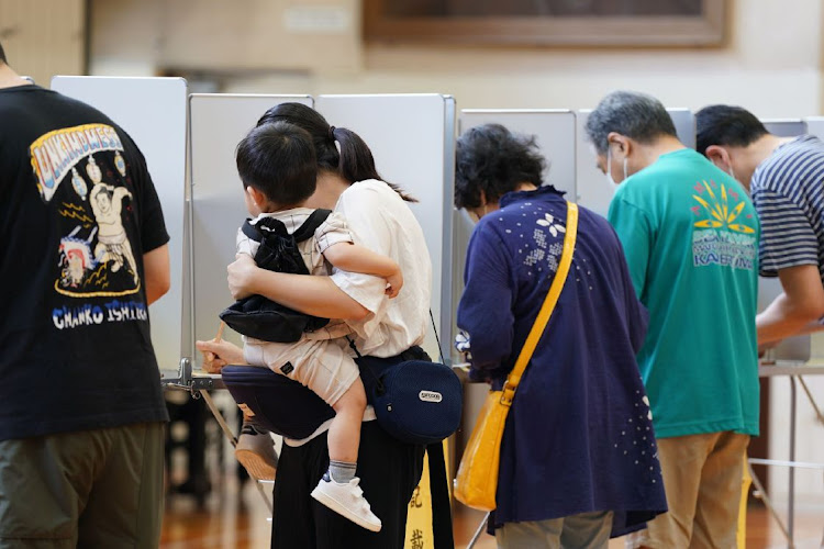 Voters cast a ballot at a polling location in the Minato district of Tokyo, Japan, July 10 2022. Picture: TORU HANAI/BLOOMBERG