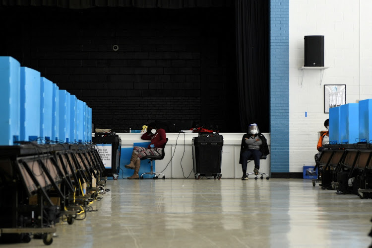 Election officials wait for voters at the International Community School on election day in Decatur, Georgia on November 3 2020. Picture: REUTERS/BRANDON BELL