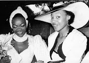 Circa 1989 | Singer Brenda Fassie on her way to get married to Nhlanhla Mbambo. Seen here with her bridesmaid Yvonne Chaka Chaka inside the hired Limousine chatting before the ceremony.