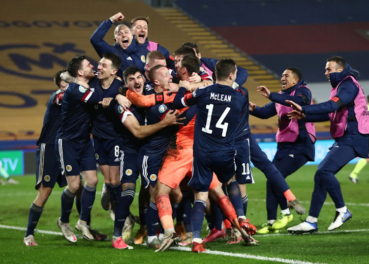 SOMETHING TO CELEBRATE: Scotland players celebrate after winning the match against Serbia on Thursday in Belgrade, Serbia REUTERS/Marko Djurica TPX IMAGES OF THE DAY