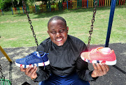 November 09,2016.  Theo   Baloyi  shows off his brand of sneakers manufactured at a factory in Bramley, Johannesburg. Pic: Veli Nhlapo © Sowetan