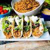 Thumbnail For Slow Cooker Shredded Taco Chicken Made Into Tortillas.