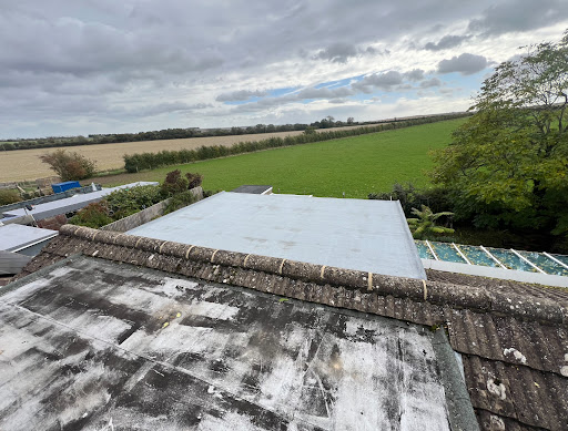 Tired old Flat dorma Roofs 
Both had been repaired and receded at different times. 
