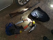 Police found an unlicensed firearm, a rifle, two hunting knives, an axe, one silencer, one Q20 lubricant spray, a spark plug spray and ammunition after searching the car.  