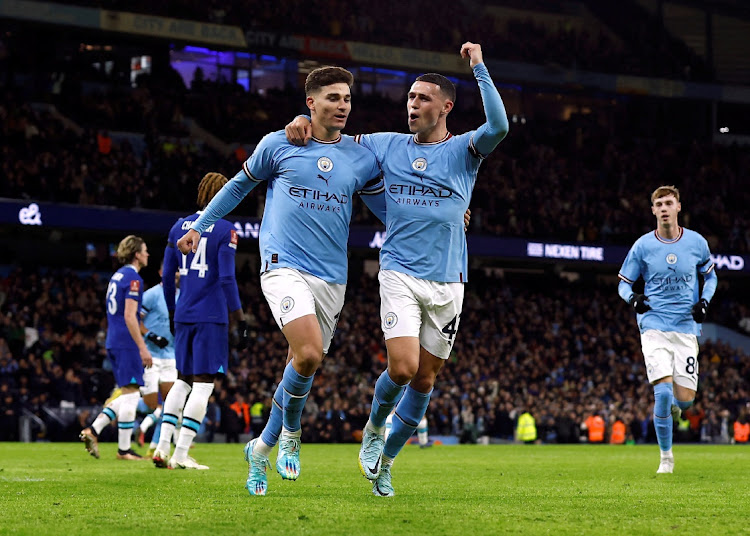 Manchester City's Julian Alvarez celebrates scoring their second goal with Phil Foden.