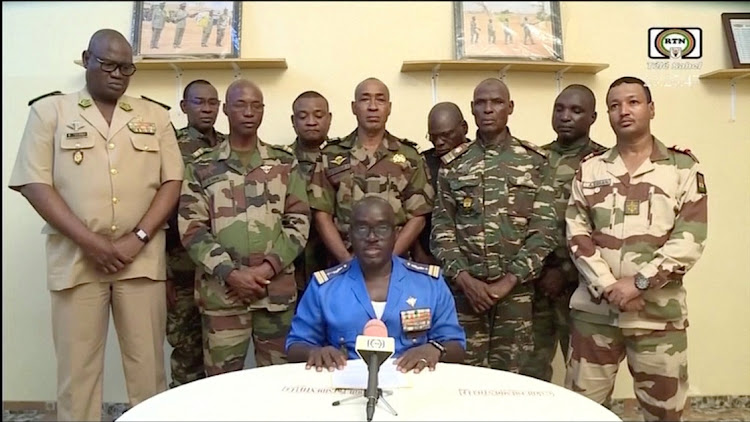 Niger army spokesperson Col-Maj Amadou Adramane speaks during an appearance on national television, after President Mohamed Bazoum was held in the presidential palace, in Niamey, Niger, July 26, 2023 in this still image taken from video.