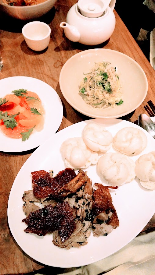  Suckling Pig with mantou buns, cabbage slaw, hot mustard and a citrus salad for Chinese New Year, Year of the Pig 2019 at Mister Jiu's in Chinatown, San Francisco