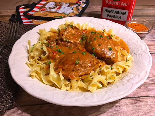 A nice and tasty Chicken Paprikash served over a bed of egg noodles.