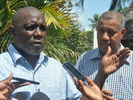 CONFLICT RESOLUTION: National Land Commission chairman Muhammad Swazuri with Lamu Governor Issa Timamy address journalists at Lawfords Hotel in Malindi on December 15, 2014.