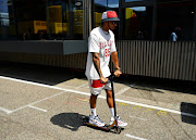 Lewis Hamilton of Great Britain and Mercedes GP rides a scooter on July 25 2019 in the Paddock during previews ahead of the German F1 Grand Prix at Hockenheimring.