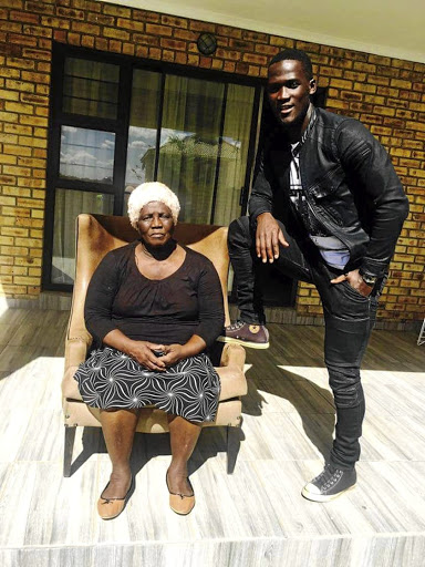 Free State Stars goalpoacher Siphelele Mthembu at home with his mother Khulekile Mthembu.