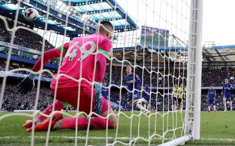 Chelsea's Cole Palmer scores their first goal from the penalty spot in their Premier League draw against Burnley at Stamford Bridge in London on Saturday.
