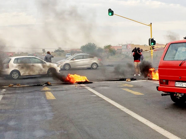 The R559 in Protea Geln, Soweto was shut down on Monday as residents whose homes were damaged during a storm in December wait for help.