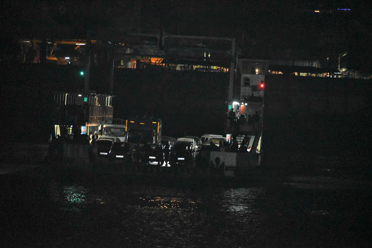 A ferry transports vehicles across the Likoni Ferry channel, Mombasa on Sunday evening.