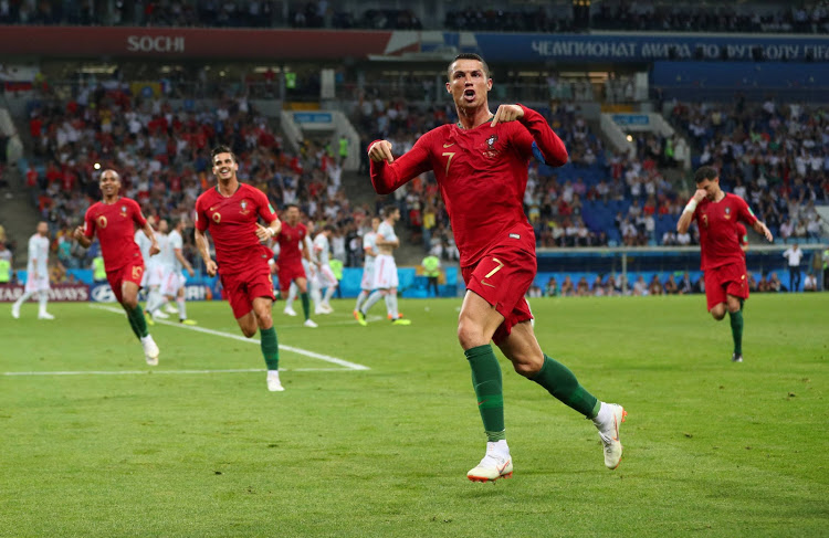 Portugal's Cristiano Ronaldo celebrates scoring their third goal to complete his hat-trick.