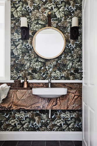 The powder room with Martyn Lawrence Bullard 'Royal Fernery' wallpaper.