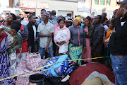 Survivors gathered outside the gutted building in the Joburg CBD. File image