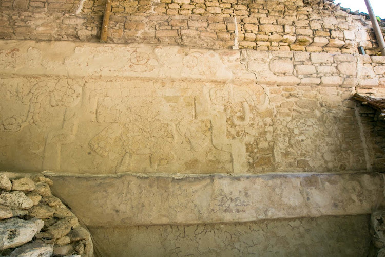 A creature of the underworld seen on the side of Temple of the Owl at Dzibanche in Mexico's Costa Maya.