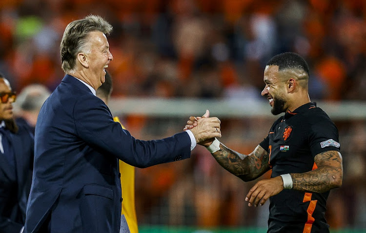 Netherlands coach Louis van Gaal and striker Memphis Depay celebrate their victory in the Uefa Nations League match against Wales at Feyenoord stadium in Rotterdam on June 14 2022.