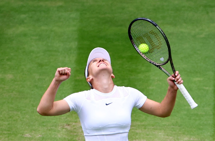 Romania's Simona Halep celebrates winning her quarter final match against Amanda Anisimova of the U.S.