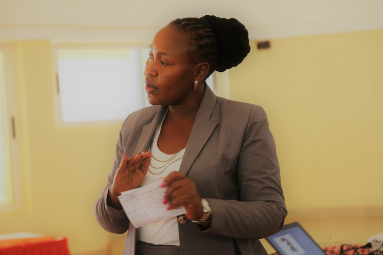 Kitui health and sanitation executive, Rosaita Ngina, addressing a meeting in 2018.