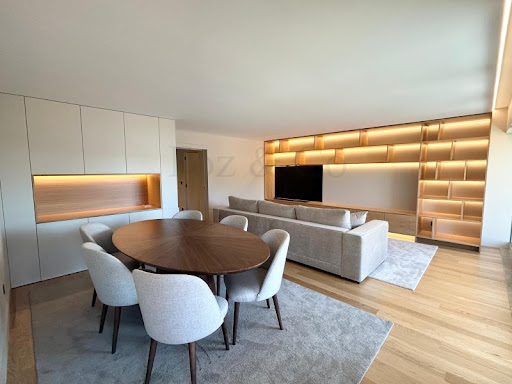 Modern dining and living room with shelves in this luxury apartment / penthouse for sale in Lordelo do Ouro e Massarelos ($1,450,924 - 136 m²)