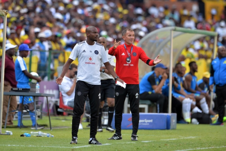 Rhulani Mokwena and Mlutin Sredojevic of Orlando Pirates and Themba Zwane of Mamelodi Sundowns during the Absa Premiership match between Mamelodi Sundowns and Orlando Pirates at Loftus Versfeld Stadium on January 13, 2018 in Pretoria.