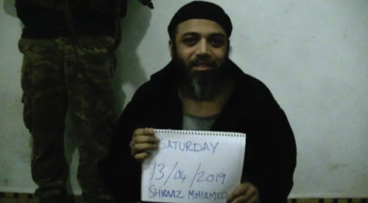 Screen grab of a video purportedly showing captured South African photographer Shiraaz Mohamed pleading for help.