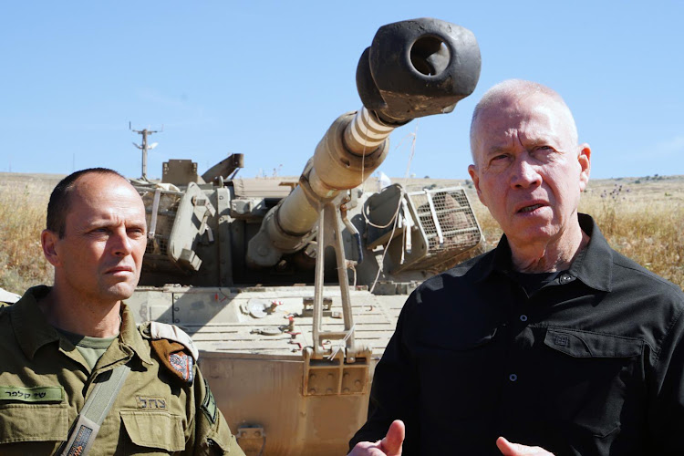 Israeli Defence Minister Yoav Gallant (in black shirt)