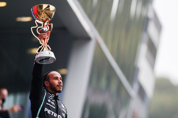 Lewis Hamilton of Mercedes and Great Britain celebrates winning his 100th Grand Prix during the Formula One Grand Prix of Russia at Sochi Autodrom on September 26, 2021 in Sochi, Russia.