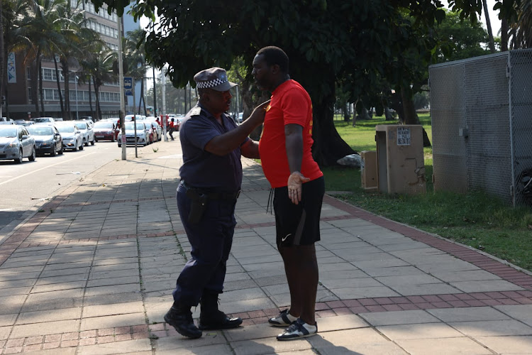 An altercation broke out between a metro police officer and a striking Transnet employee after he tried to block the road from Victoria Embarkment to the Transnet terminal in Bayhead.