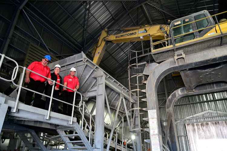 PPC staff, from left, plant engineer Johan Coetzee, coastal unit business head Johan Vorster and area Eastern Cape sales manager Barry Jacobs survey the company's new clinker offloading facility in Deal Party, Port Elizabeth.