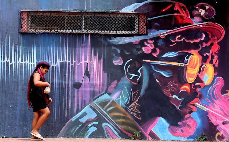 This picture of a girl walking past a colourful mural at Charlees Empire near the Nelson Mandela Bay Stadium is one of many taken by Herald and Weekend Post photographer Fredlin Adriaan that graced the front page over the years. This one was published last month