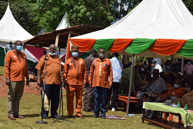 Some of the Kikuyu Council of Elders chairman Wachira Kiago, vice chair David Muthoga and Organising Secretary James Nene during the burial of Homa Bay Luo council of elders member Odak Mbaka in Kasipul constituency on November 13,2020