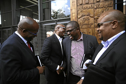 NO WORRIES: ANC national spokesman Zizi Kodwa and Sassa CEO Thokozani Magwaza found something to laugh about, while inside, the Constitutional Court was hearing an urgent application by the Black Sash that the court play an oversight role in the payment of social grants.