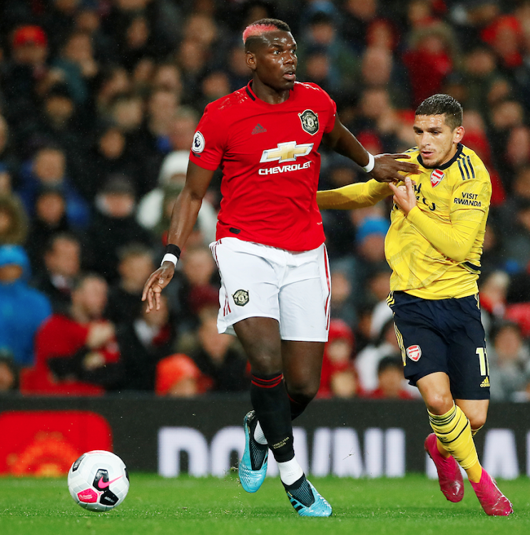 Manchester United's Paul Pogba in action with Arsenal's Lucas Torreira