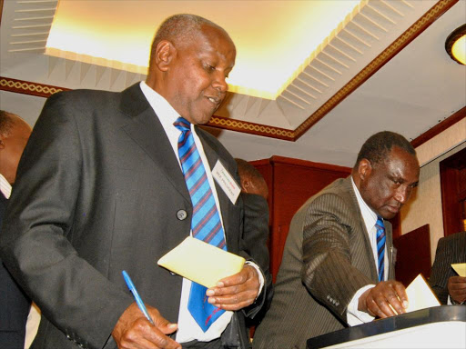 Athletics Kenya vice chairman Paul Mutwii, Athletics Kenya President Isaiah Kiplagat and Secretary General David Okeyo cast votes during AK Elections.