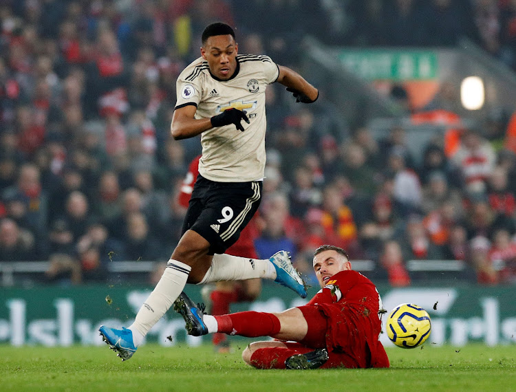 Manchester United's Anthony Martial in action with Liverpool's Jordan Henderson