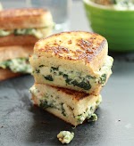 Spinach and Artichoke Melts was pinched from <a href="http://www.halfbakedharvest.com/spinach-and-artichoke-melts/" target="_blank">www.halfbakedharvest.com.</a>