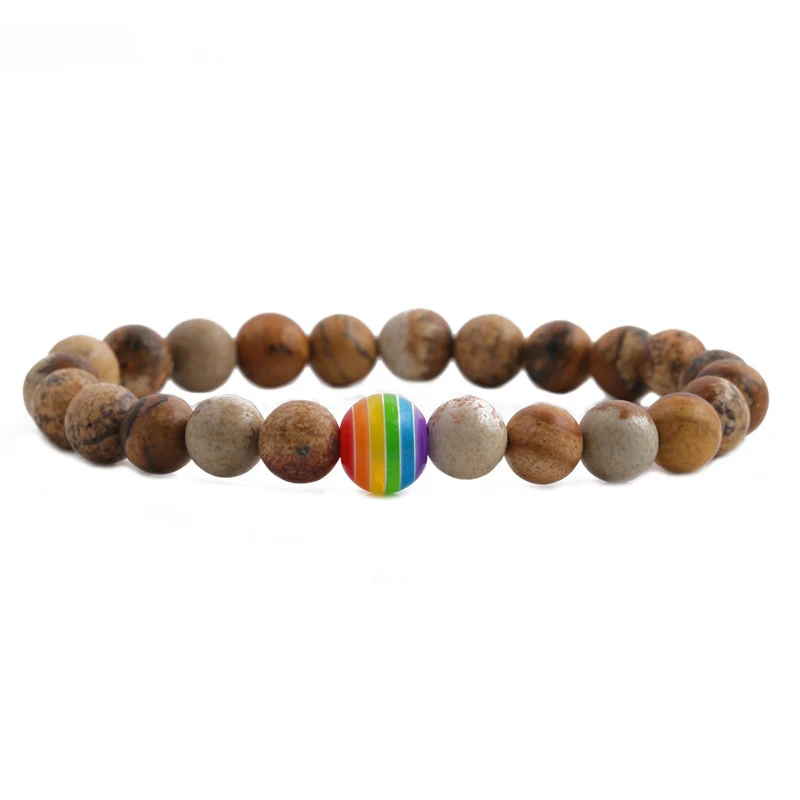 Vulkanische rots koppelarmband met kleurrijke chakra's, breng evenwicht en harmonie in je relatie.