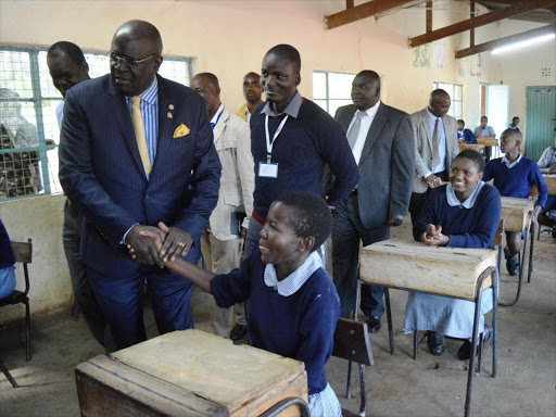 Knec chairman George Magoha (left) at Joel Omino Primary School on Thursday in Kisumu /FAITH MATETE