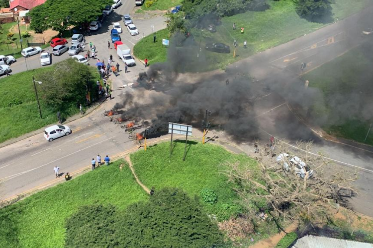 Angry residents recently burnt debris and tyres at the intersection of Parkgate and Ottawa in protest against weeks of going without water. File photo.