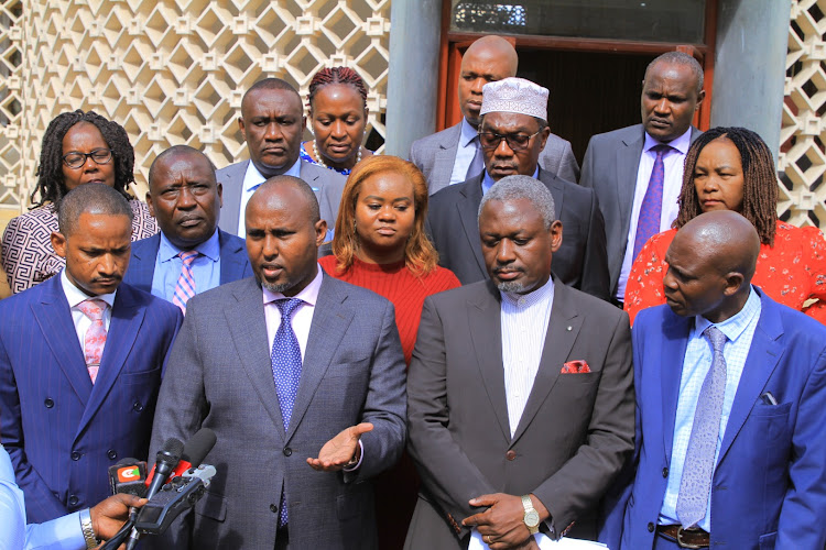 Azimio coalition MPs led by Suna East Mp Junet Mohamed address the press outside parliament after walking of during the amendment stage of the Housing bill on February 21, 2024.